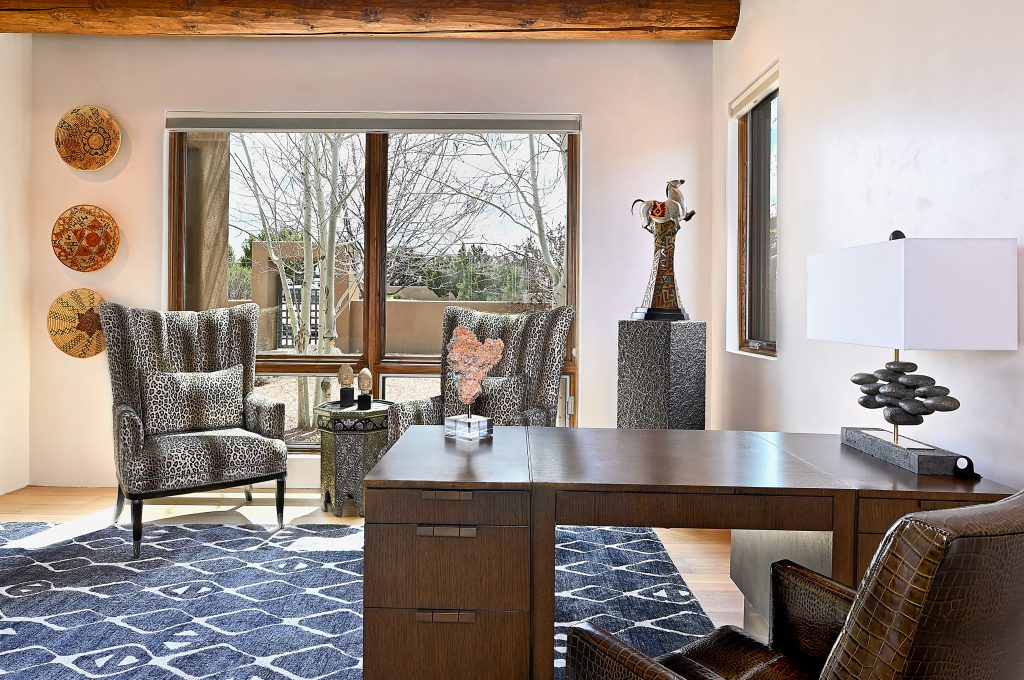 Santa Fe interior design by JDouglas Design in showcasing local artwork and reclaimed wood ceilings.